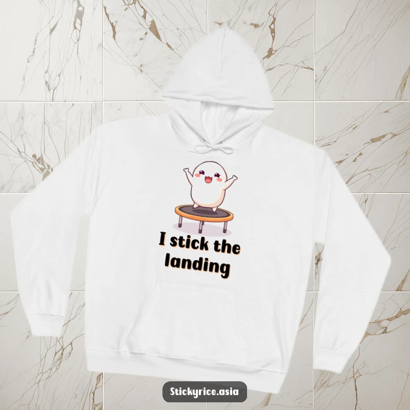 Funny hoodie depicting a cheerful sticky rice dumpling energetically bouncing on a trampoline, radiating happiness and playful vibes.
