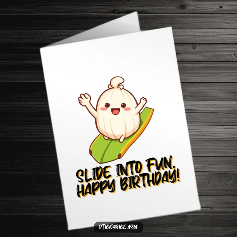 Funny Free Printable Birthday Card: Waving sticky rice clump happily sliding down a bananaleaf ramp, celebrating birthday with smooth humor.